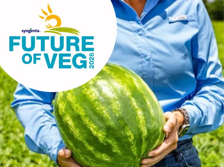 Person in blue shirt holding a large watermelon in a field, with “Future of Veg” logo